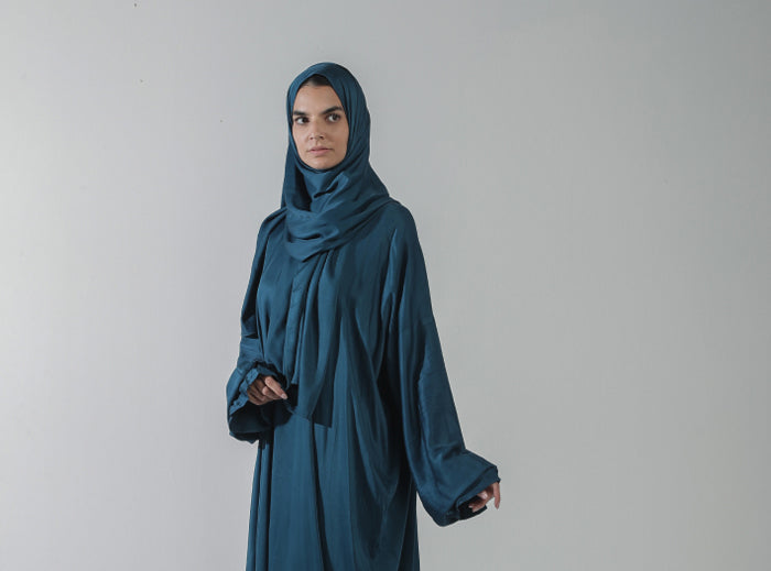 Women wear black prayer dress by Alef Meem